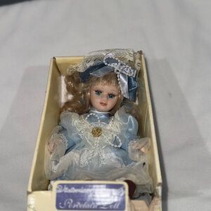 Elegant Porcelain Doll in Blue Lace Dress